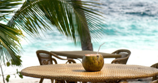 fresh coconut ready to drink on a tropical beach