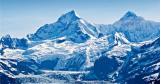 Glacier and snow capped mountains in the Glacier Bay National Park Alaska